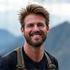 Portrait of Mark J., a rugged outdoor enthusiast smiling.